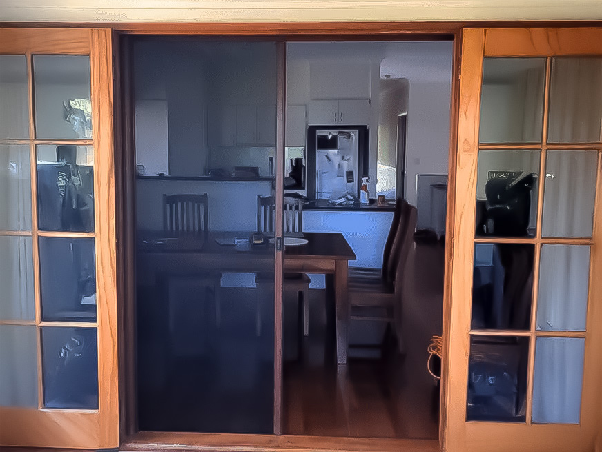 Retractable insect screens fitted to timber french doors Retractable Screen installed on timber French Doors