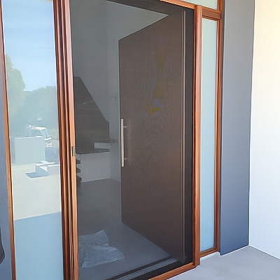 Large timber front door with retractable insect screen