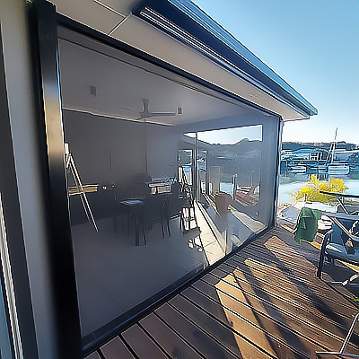 Outdoor living area with retractable fly screen installed