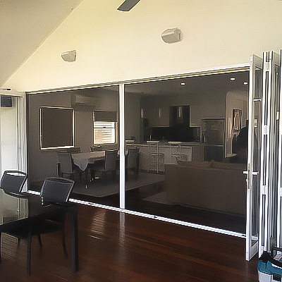 White bifold patio doors with retractable screen